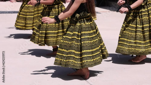 Synchronized hula dance steps with bare feet