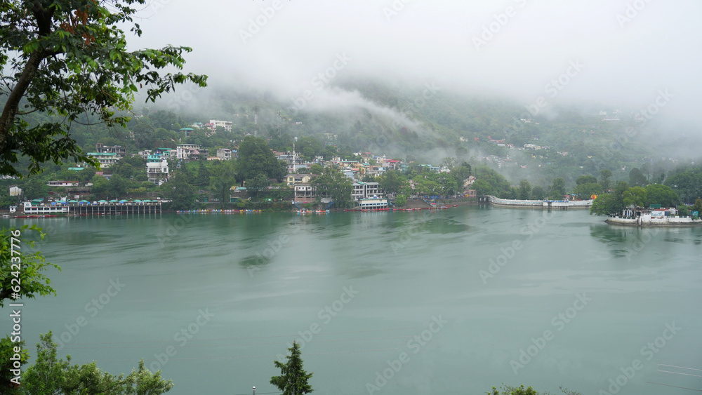 Serene Lake View, Mountain Homes, and Ethereal Mist