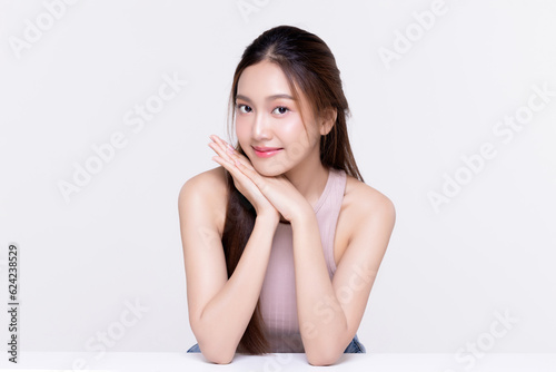 Beautiful young Asian woman with healthy and perfect skin on isolated white background. Facial and skin care concept for commercial advertising.