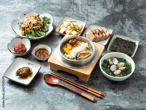 Korean traditional food, various side dishes and abalone pot rice
