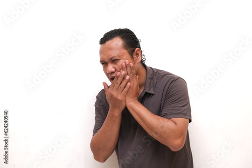 asian man with toothache feeling expression isolated white background