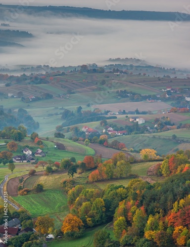 Fall landscape in Slovakia. Rural countryside in Polana region. Fields and meadows with autumn trees in Hrinova at sunrise. © Ivan