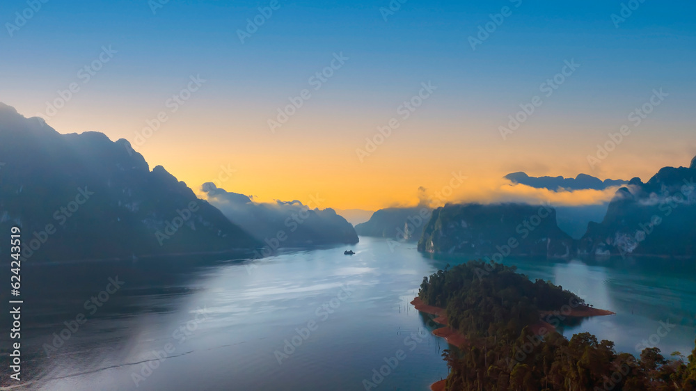 The Aerial  sunset view at Khao Sok national park Cheow Lan Dam lake with blue sky background  in Surat Thani, Thailand