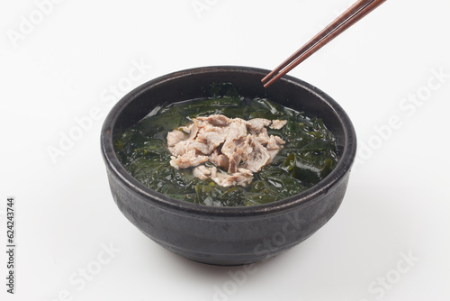 A soup made with seaweed and beef. photo