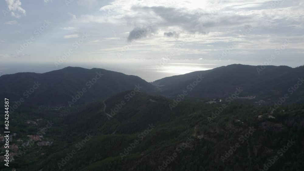 fascinating video shot over the flying pines of the Bracco pass in Italy, in the background the sea and the Deiva marina beach fascinating video shot over the flying pines of the Bracco pass in Italy, in the background the sea and the Deiva marina beach