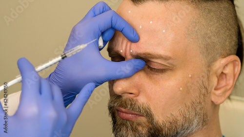 Fotografie Anti-aging treatment on face with botulinum toxin