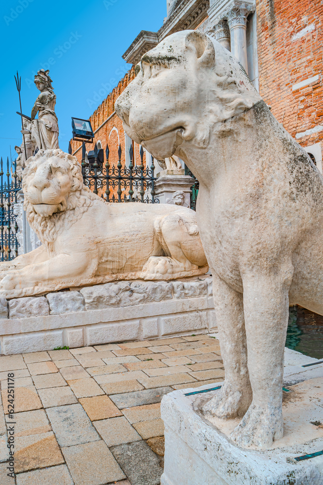 Famous Arsenal, military fortress, gate, bridge and church with many statues of Piraeus lions in historical downtown of Venice, Italy