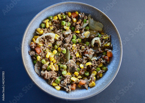 An inexpensive and tasty meal of minced beef with vegetables and sriracha sauce