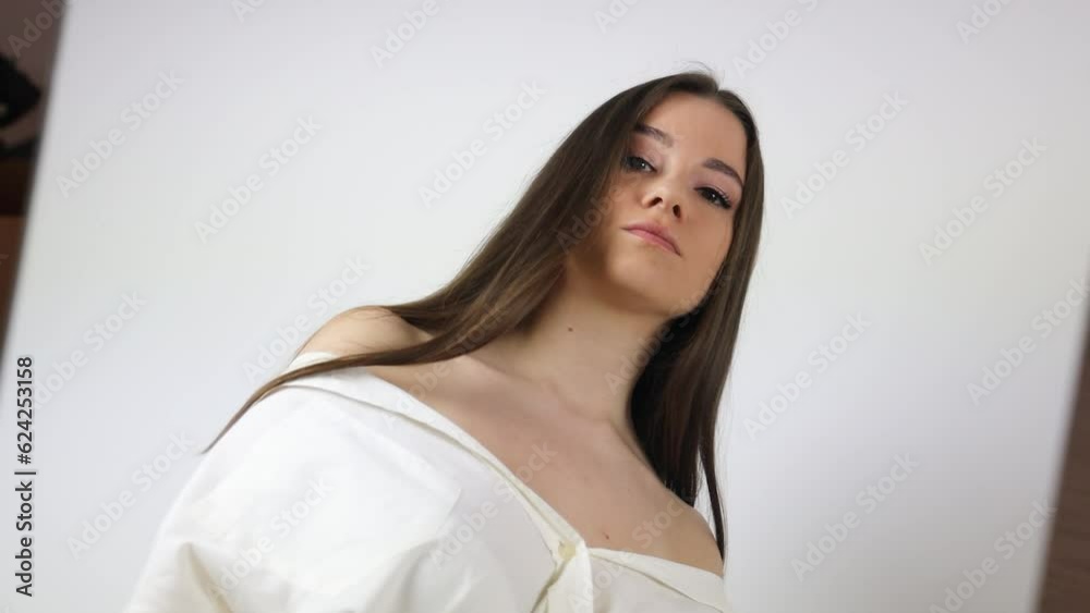 Young Caucasian model posing and moving in front of a mirror Young Caucasian model posing and moving in front of a mirror