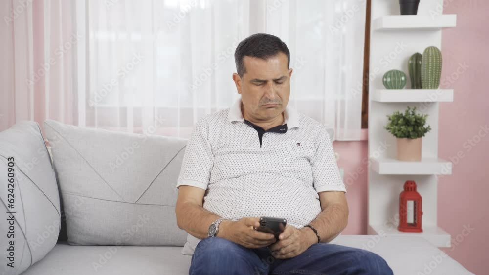 Disappointed man texting. Disappointed man texting.