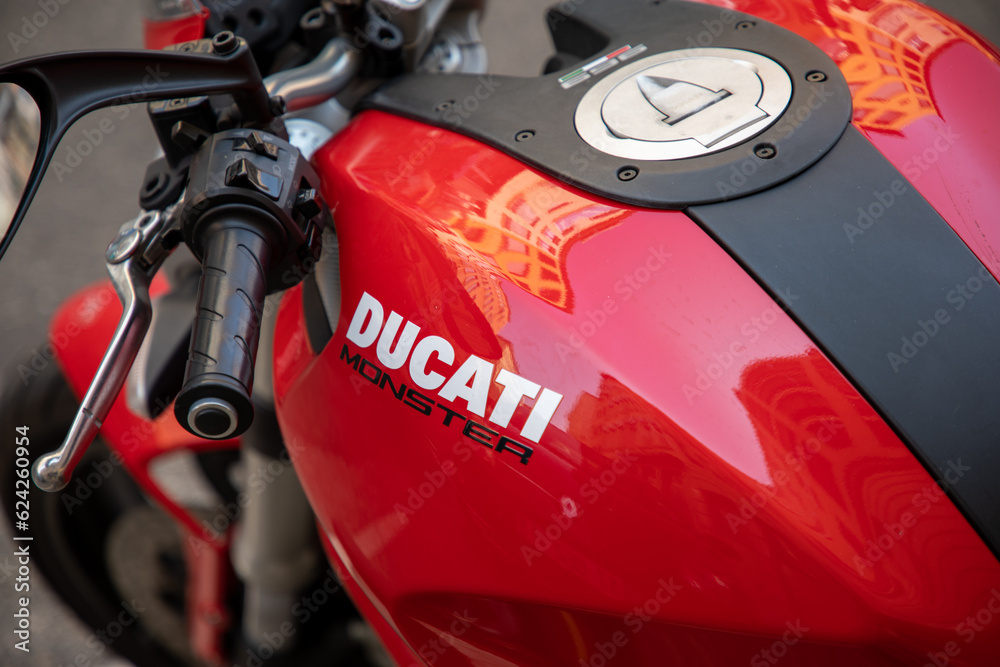 Ducati monster fuel tank red motorcycle logo brand and text sign of