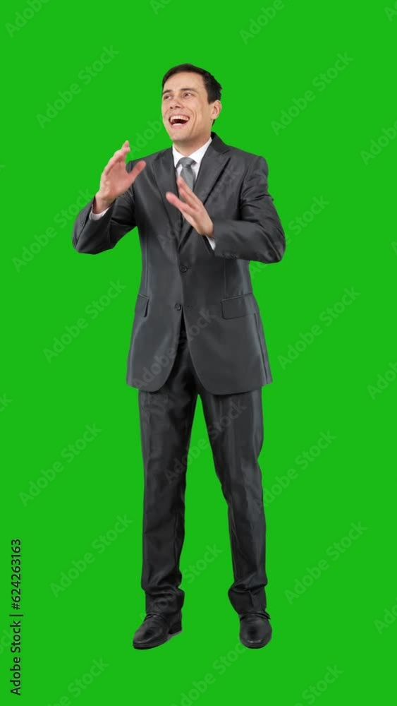 Cunning businessman rubbing hands in studio. Chroma key Cunning businessman rubbing hands in studio. Chroma key