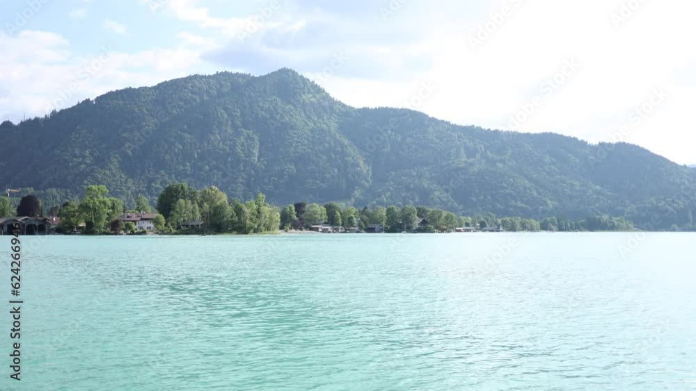 Landscape of beautiful clear blue lake between mountains Landscape of beautiful clear blue lake between mountains