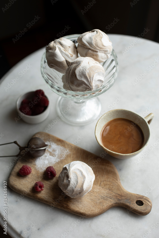 cup of coffee and zephyr on white table top view. coffee with white zephyr. sweets for breakfast cup of coffee and zephyr on white table top view. coffee with white zephyr. sweets for breakfast