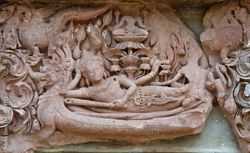 Lintel of ancient Narai Banthomsin on monster naga and dragon in the sea of Phanom rung in Thailand photo