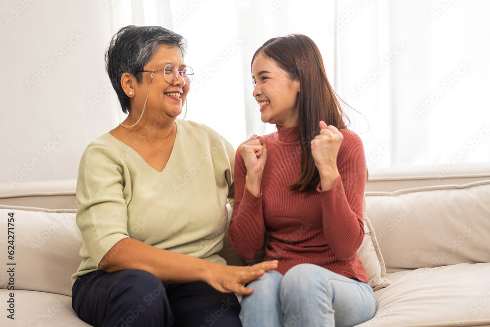 Portrait of enjoy happy love asian family senior mature mother and young daughter smiling play laughing and having fun together at home, care, elderly, insurance.happy family and Mother Day concept Portrait of enjoy happy love asian family senior mature mother and young daughter smiling play laughing and having fun together at home, care, elderly, insurance.happy family and Mother Day concept
