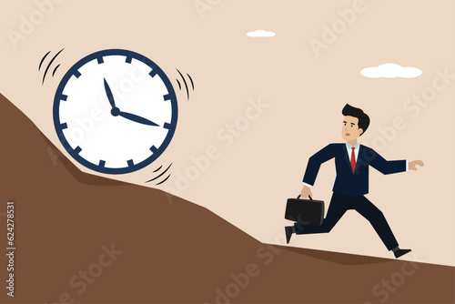 Running out of time, time countdown or time management concept, businessman trying to escape from falling big clock rolling down hill.