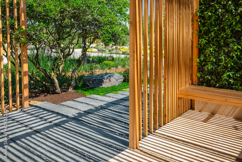 Canvastavla Modern wooden arbor. Modern wooden gazebo in courtyard, backyard
