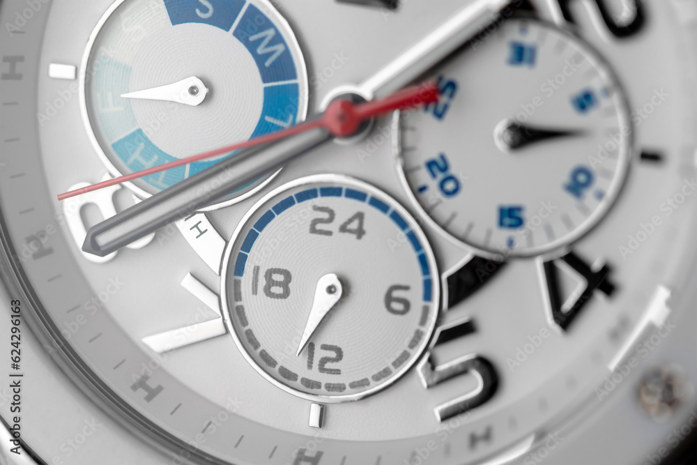 White gold wrist watch with diamonds. Chronograph close up. White gold wrist watch with diamonds. Chronograph close up.