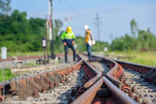 Wallpaper Mural Selective focus on railway line Workers or engineers who maintain railway tracks Check the switchgear building process and check the work in the train station. Torontodigital.ca
