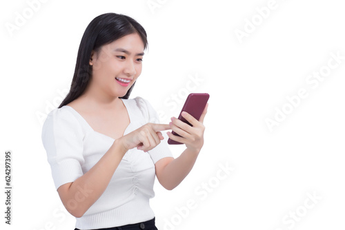 Pretty young Asian woman in a white shirt smiles confident happily successful while holds smartphone while looking at smart phone screen with isolated on white background.