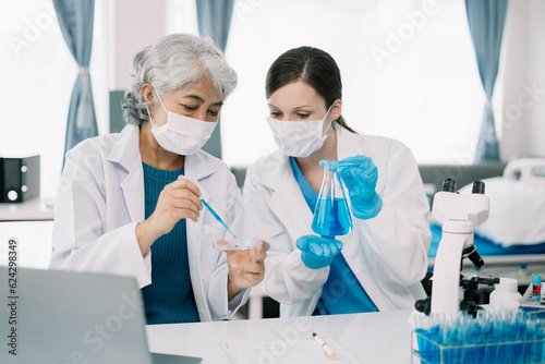 Scientist works with a pipette and a test tube. Scientific laboratory of biotechnology, development of medicine and research in chemistry, biochemistry and experiments.