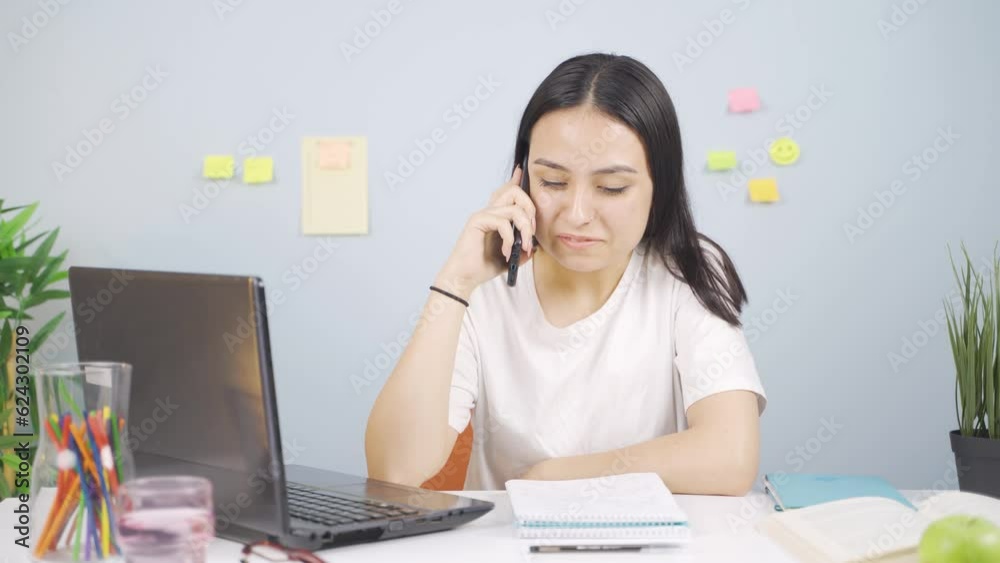 Female student getting good news on the phone. Female student getting good news on the phone.