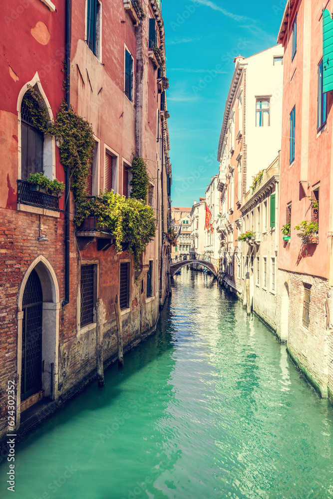 Scenic narrow canal in Venice, Italy.