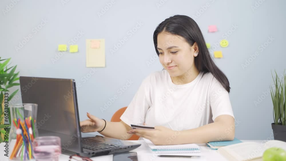 Female student doing e-commerce shopping. Female student doing e-commerce shopping.