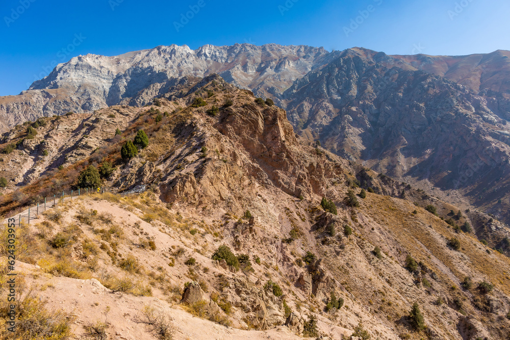 View from above. Mountain landscape of the South of Uzbekistan. Beautiful high mountains in autumn. Mountain hiking in Uzbekistan.