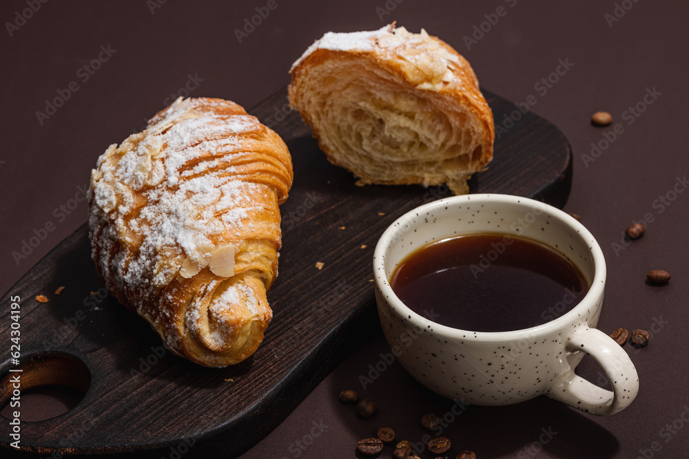Good morning concept. Breakfast with cup of coffee and fresh croissant. Sweet creamy sauce Good morning concept. Breakfast with cup of coffee and fresh croissant. Sweet creamy sauce