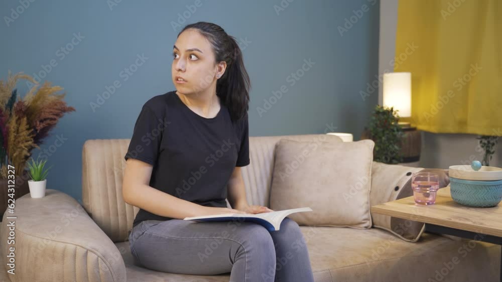 The cowardly young woman who thinks she hears a voice while reading a book. The cowardly young woman who thinks she hears a voice while reading a book.