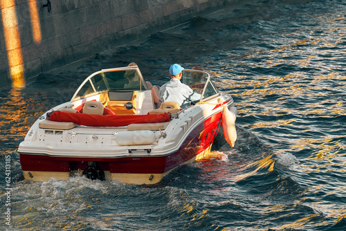 Bilde på lerret Motorboat floats on the channel
