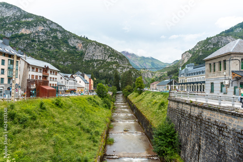 View of the old train station of Canfranc in the Aragonese Pyrenees next to the river. Spain photo