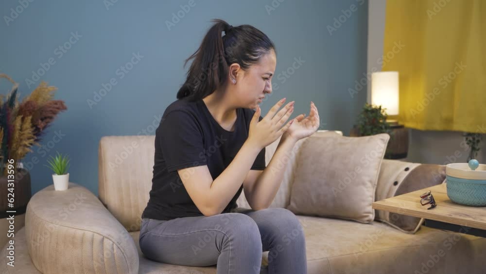 Young woman slapping herself with a nervous breakdown. Young woman slapping herself with a nervous breakdown.