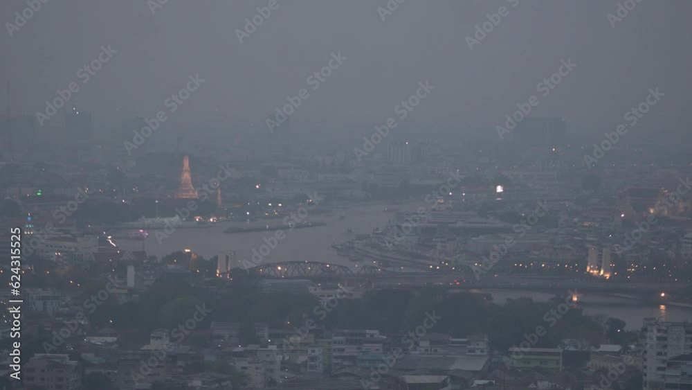 The cityscape of Bangkok is obscured by a thick blanket of dust and