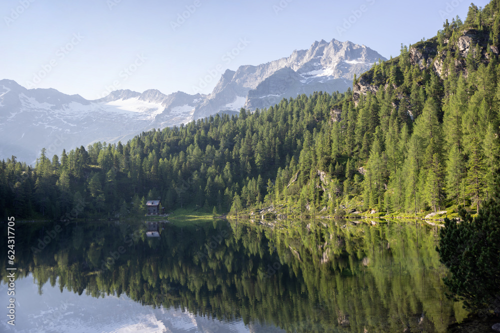 Nature background. Picturesque mountain lake in the summer morning in the Alps