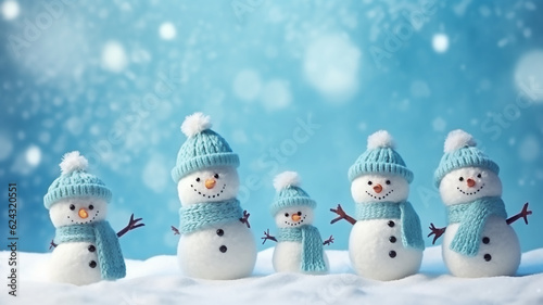 Little knitted snowmans on soft snow on blue background, Blurry background, template, Bokeh, Copy Space, Generative AI © KJ Photo studio