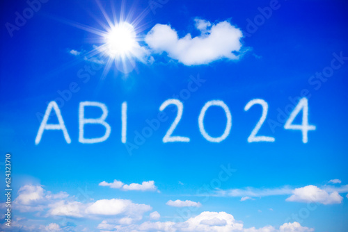 Fotografi ABI 2024 written on sunny blue sky