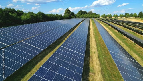 Tracking shot of agri solar ground-mounted solar panels to produce renewable energy