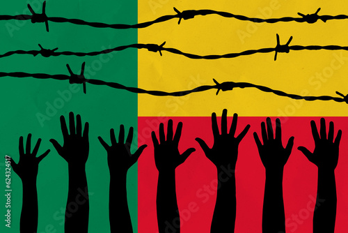 Benin flag behind barbed wire fence. Group of people hands. Freedom and propaganda concept