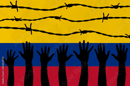 Colombia flag behind barbed wire fence. Group of people hands. Freedom and propaganda concept