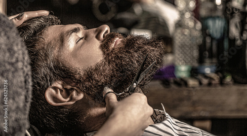 Barber scissors, barber shop. Vintage barbershop, shaving. Man hairstylist. Beard man in barbershop