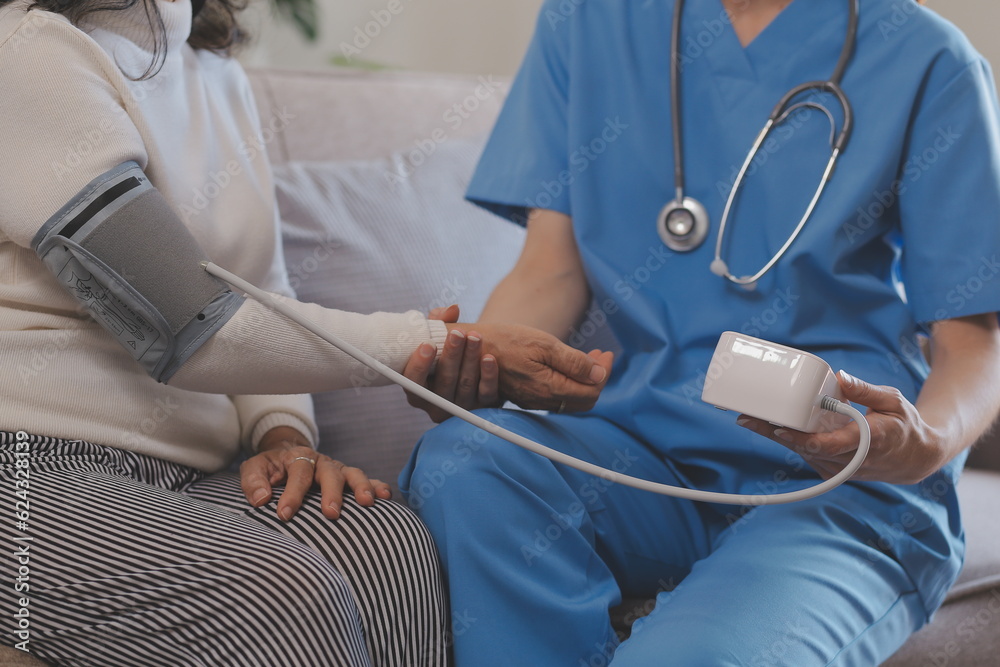 Doctor and patient talking while sitting at the desk in hospital office, closeup of human hands. Medicine and health care concept Doctor and patient talking while sitting at the desk in hospital office, closeup of human hands. Medicine and health care concept