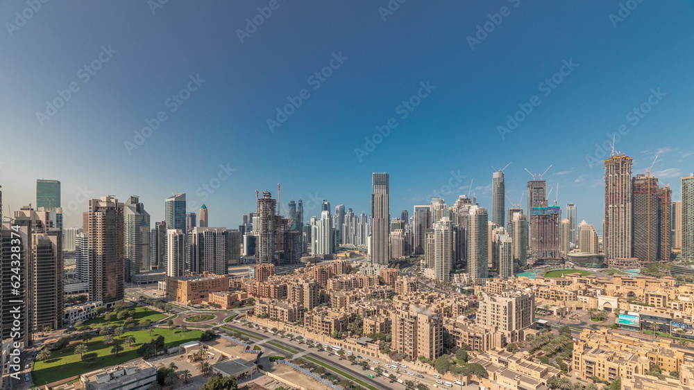 Panorama showing Dubai's business bay towers aerial morning timelapse. Rooftop view of some skyscrapers