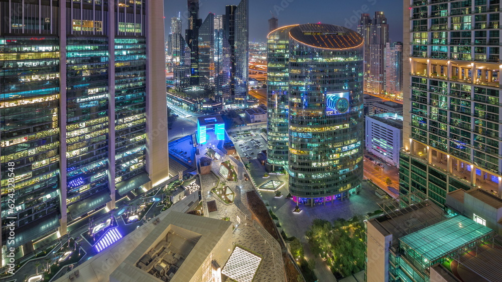 Dubai international financial center skyscrapers aerial day to night timelapse. Dubai international financial center skyscrapers aerial day to night timelapse.