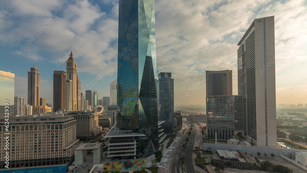 Fototapeta premium Dubai International Financial district aerial night to day timelapse. Panoramic view of business office towers.