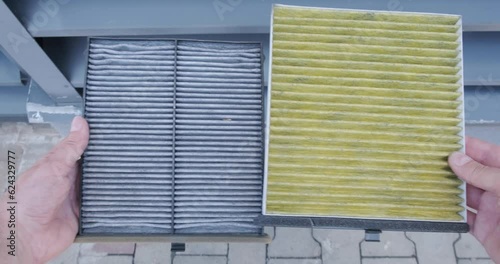 New and old cabin air filters used to filter air inside a car, side by side. Auto, replacement part.