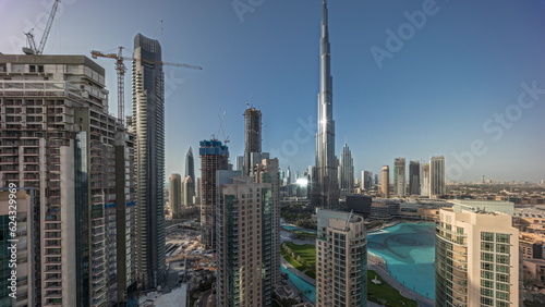 Panorama showing Dubai Downtown cityscape with tallest skyscrapers around aerial timelapse.
