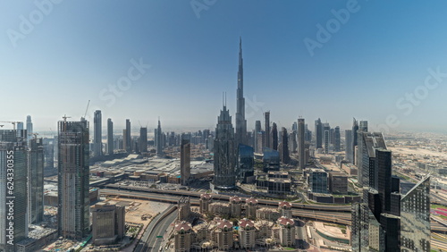 Panorama showing aerial view of tallest towers in Dubai Downtown skyline and highway timelapse. © neiezhmakov